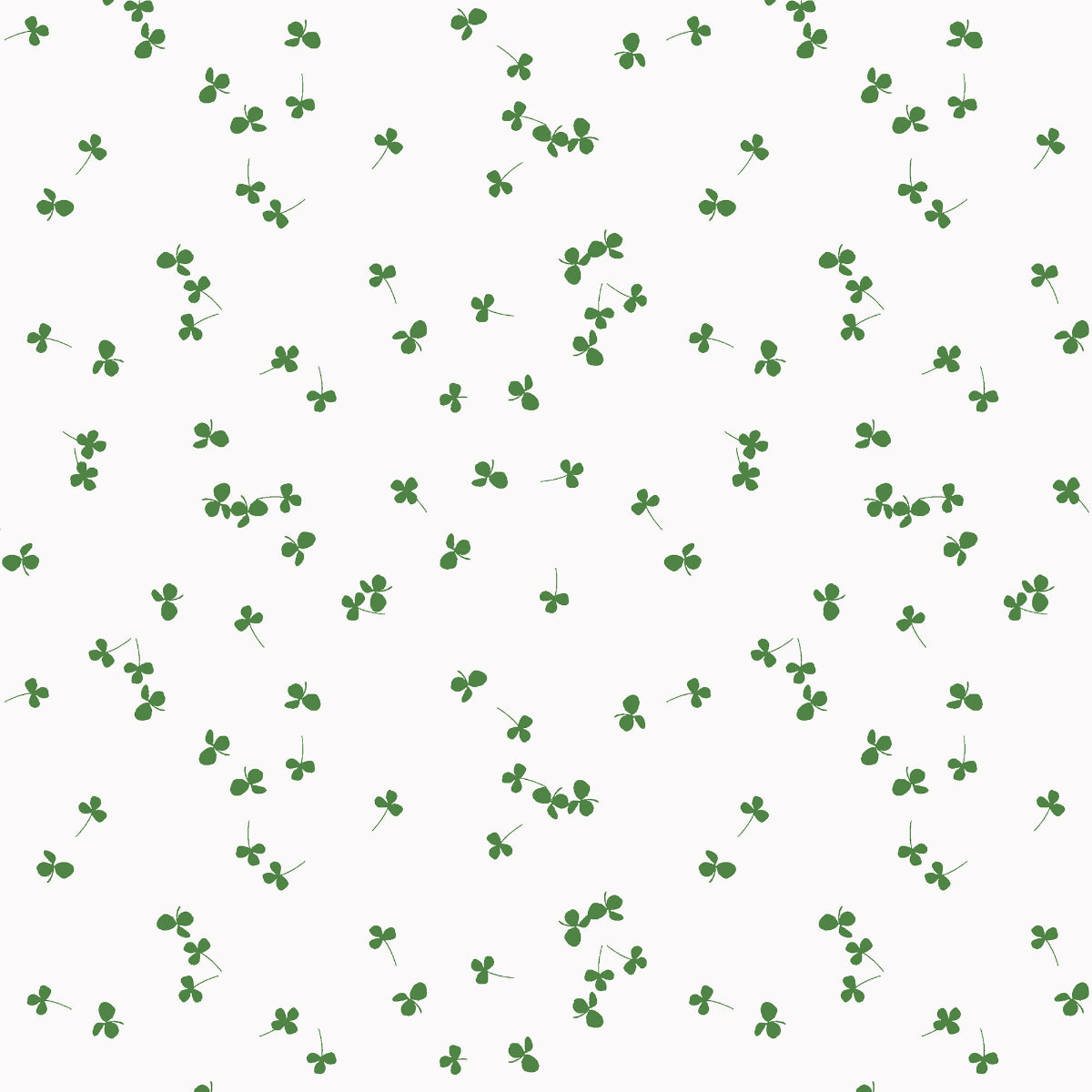 Pattern of green clover leaves on a white background