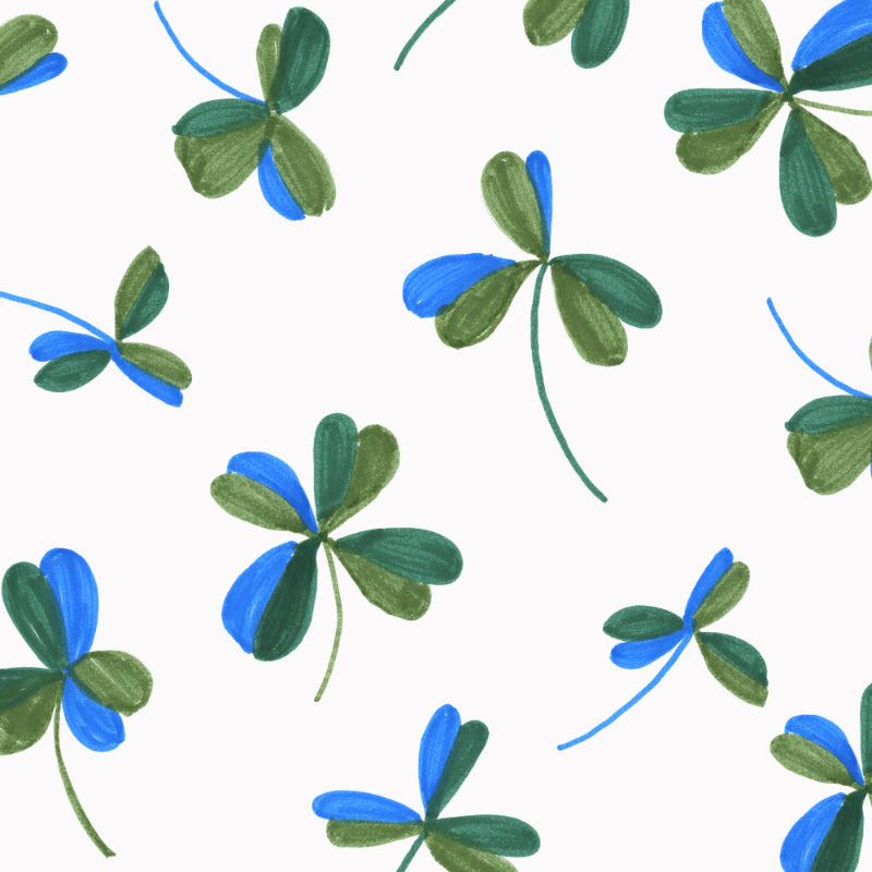Pattern of blue and green four-leaf clovers on a white background