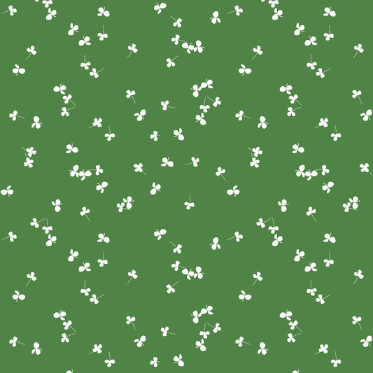 White clover pattern on a green background