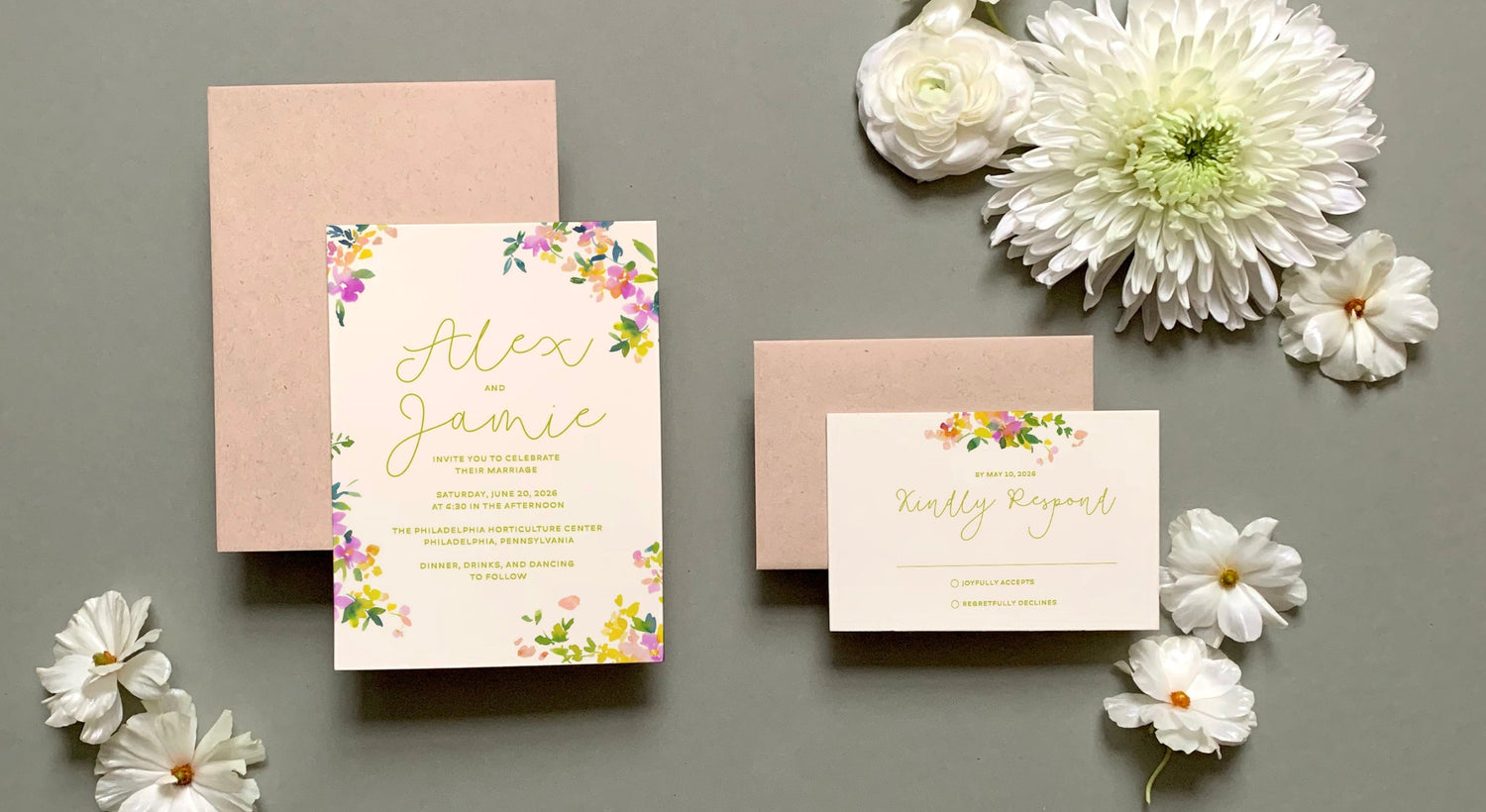 Wedding invitation card with envelopes and decorative flowers on a gray background