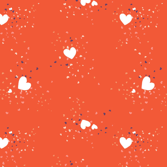 A patterned fabric with a red background, featuring white hearts and smaller blue speckled details.