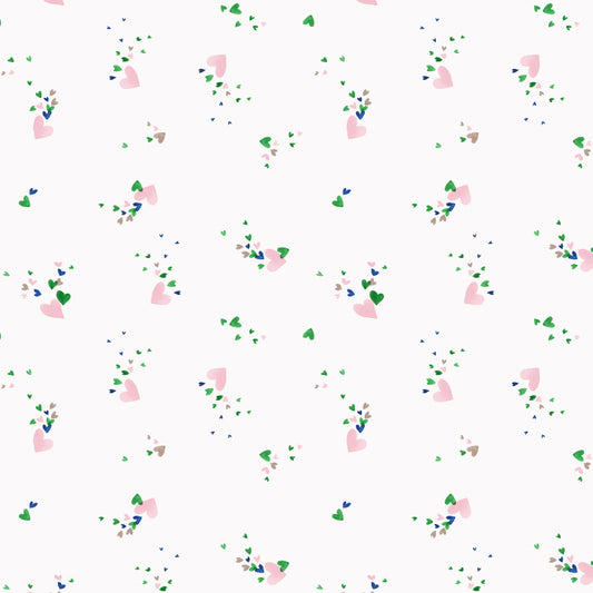A patterned fabric with a watercolor design featuring small pink hearts and green speckles on a white background.