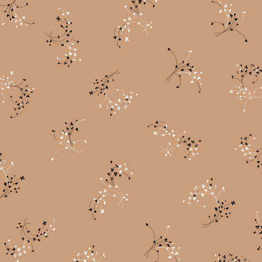 A patterned fabric with a small scale floral design in beige, black, and white colors.